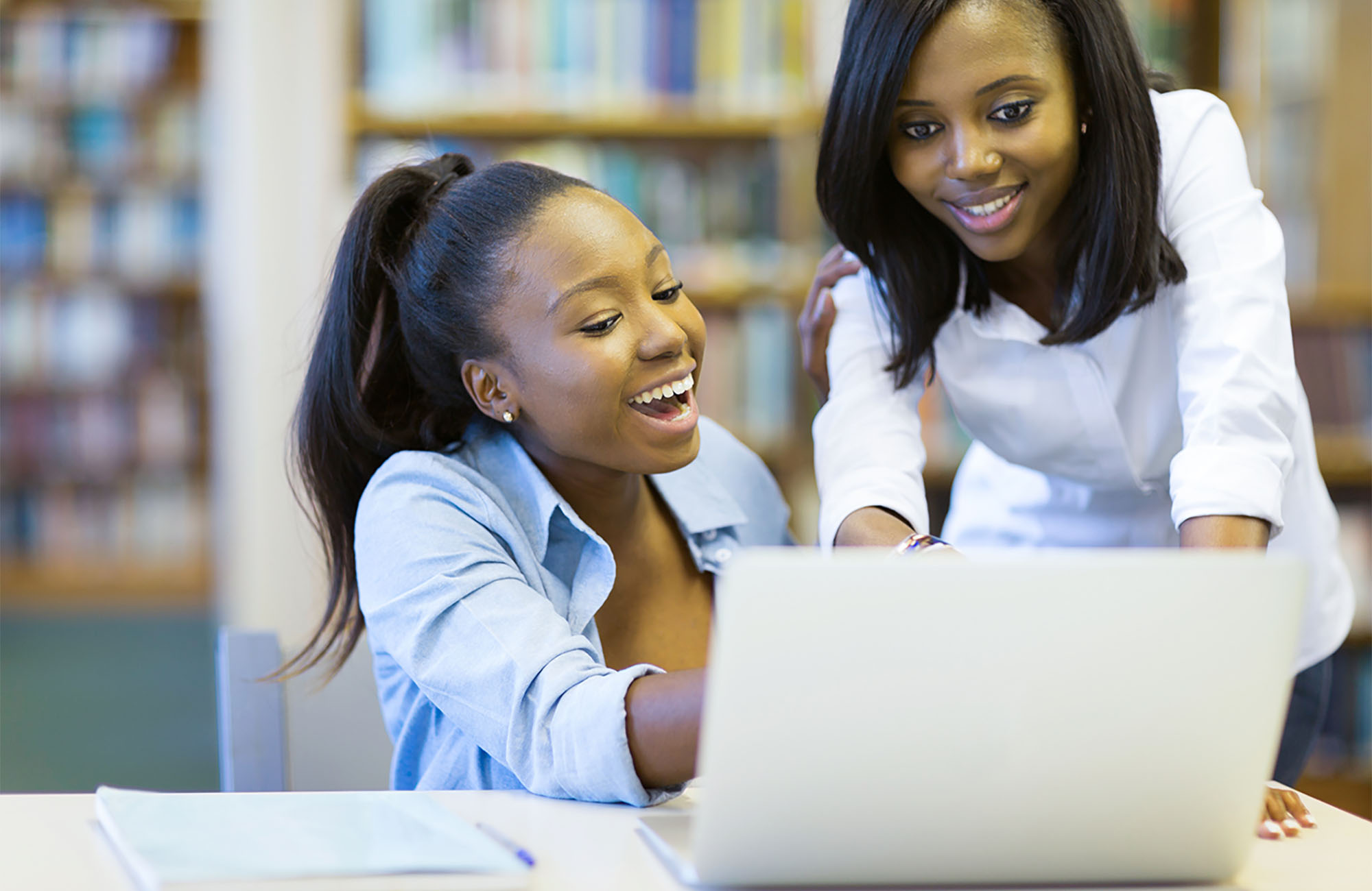 african american college students using laptop