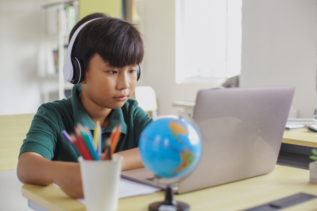 Asian-student-studying-using-a-laptop