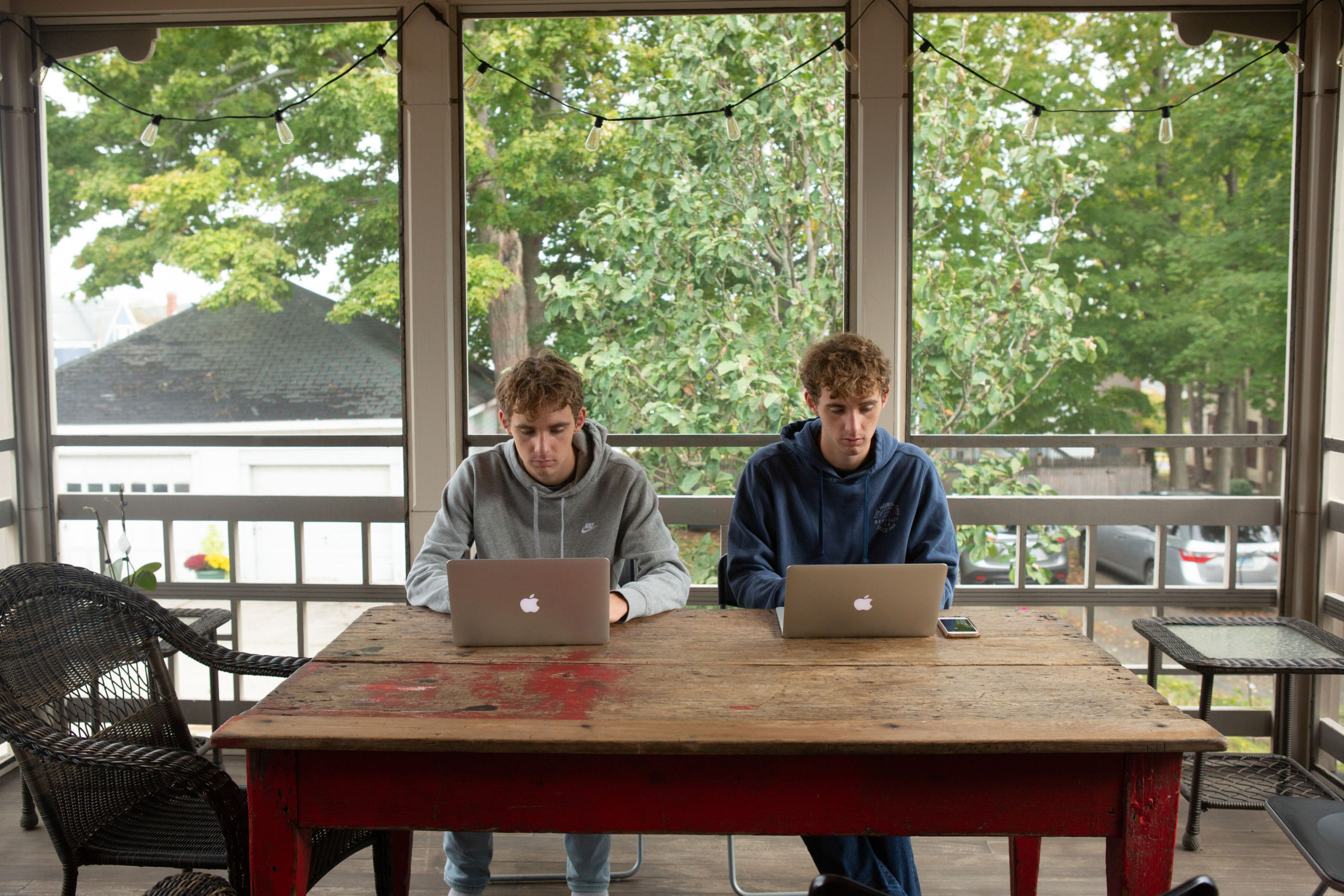 Two students working online from home.