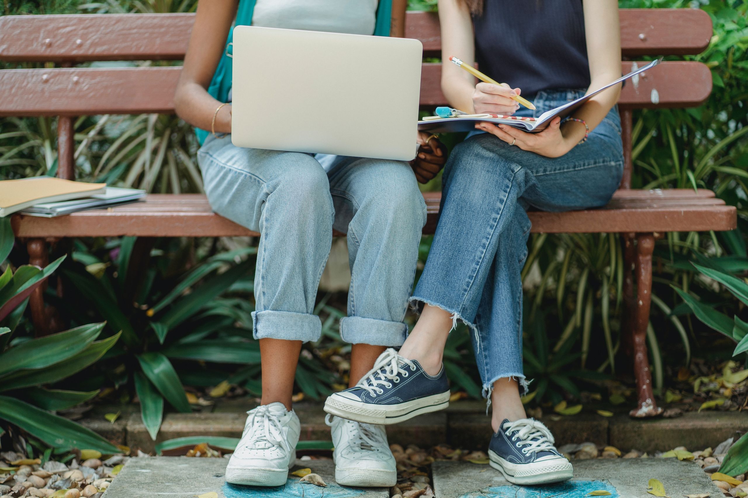 Students sitting on a bench.